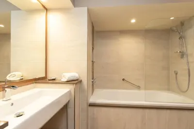 a bathroom with a tub and a sink at Underscar - Skiddaw in Keswick