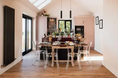 a dining room with a table and chairs at Firth View 1 - Luxury Cottage with Sea View & Hot Tub, Ayr in Ayr