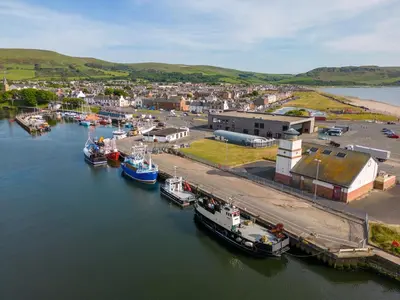 an aerial view of boats docked in a harbor at The Signal Box in Girvan