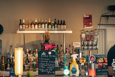a bar with a lot of bottles of alcohol at 23 Chestnut Grove in Kirkcolm