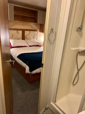 a small bedroom with a bed in a room at 23 Chestnut Grove in Kirkcolm