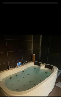 a large bath tub in a bathroom with at Brig O'Doon 1 in Ayr