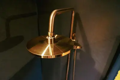 a brass lamp is hanging on a wall at Glencartholm Farm by Wigwam Holidays in Canonbie