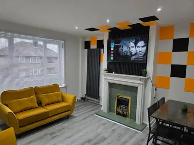 a living room with a couch and a fireplace at Bridgepay Modern 4 bedroom House in Cumbria - Whitehaven - Free Parking in Whitehaven