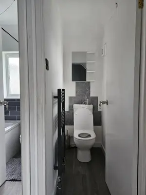 a bathroom with a toilet and a tub and a sink at Bridgepay Modern 4 bedroom House in Cumbria - Whitehaven - Free Parking in Whitehaven