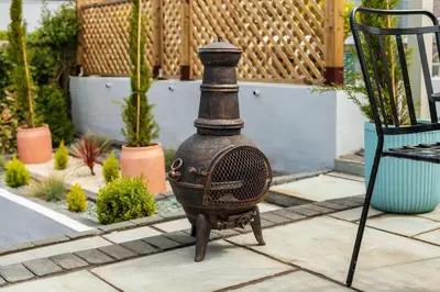 a vase sitting on the ground in a garden at Tranquil House with Sea Views in Parton