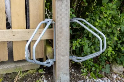 a pair ofabinets attached to a wooden fence at Tranquil House with Sea Views in Parton