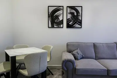 a living room with a couch and a table at Marchfield Promenade View in Prestwick