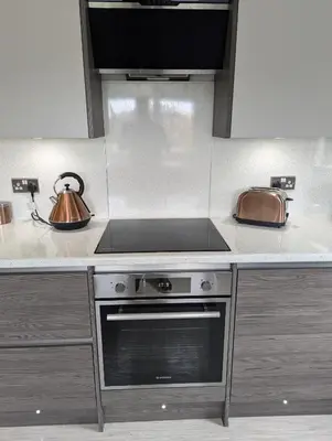 a kitchen with a stove and a tea kettle at Doonhill in Portpatrick in Portpatrick