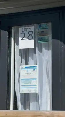 a window with a curtain and signs on it at Carlisle CAMELOT HOLIDAY PARK CA65SZ MANOR in Longtown