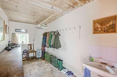 a bathroom with a tub and a sink in a room at Bellrigg in Castle Douglas