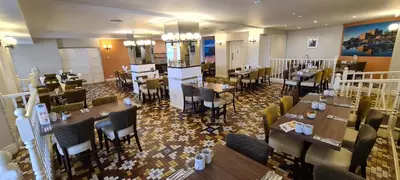 an overhead view of a restaurant with tables and chairs at The Empress Hotel in Douglas