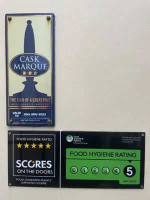 a sign on a wall with food hygiene signs at Room with Newly Renovated Private Bathroom above Village Pub Stag Inn Crosby Maryport in Maryport