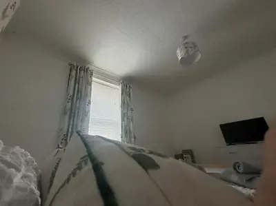 a bedroom with a bed and a window at Lonsdale Terrace - 3 Bedrooms - Sleeps 6 in Workington
