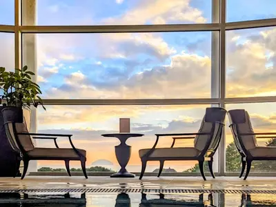 a room with two chairs and a table in front of a large window at Royal Aberdeen - Ukc6917 in Turnberry