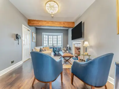 a living room with blue chairs and a couch at Royal Dornoch - Ukc6918 in Turnberry