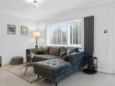 a living room with a couch and a window at Modern & Stylish 2 Bed Home in Whitehaven in Whitehaven