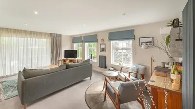 a living room with a couch and a table at Derwentwater View in Portinscale