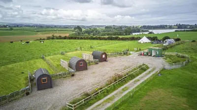an aerial view of a farm with domes in a field at Unit 2 - Carrock View Camping Pod in Carlisle