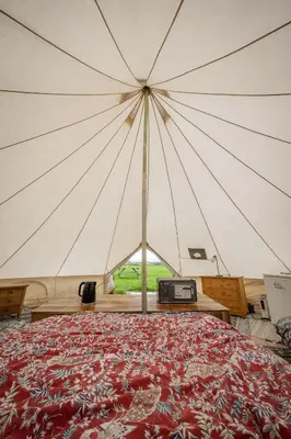 a large tent with a bed in a room at Unit 1 - Dolly Daydream Bell Tent in Carlisle