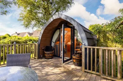 a gazebo with a table and chairs on a deck at The Kellbank in Gosforth