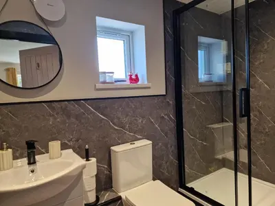 a bathroom with a toilet and a sink at The Den by Blake View Holidays a peaceful boutique retreat 3 miles from Ennerdale- standard twin or super-king bed available in Rowrah
