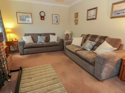 a living room with two couches and a couch at The Barn at Daldorch in Mauchline