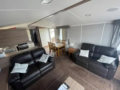 an overhead view of a living room with a couch and a table at Lake District Stunning Lodge in Plumbland