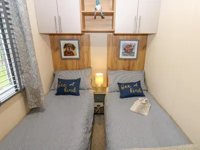 a small room with two beds in a tiny house at Plot 41 in Carlisle