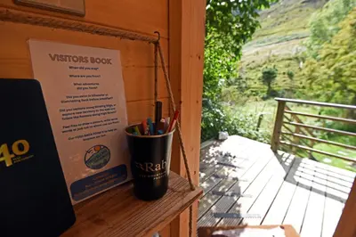 a cup of pens and pencils sitting on a wall at Helvellyn - The Hut - Twin or Double in Glenridding