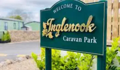 a green sign for a california park at The Lake District Caravan in Lamplugh
