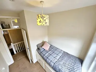 a room with a couch and a chandelier at Ashley House, Carlisle in Carlisle