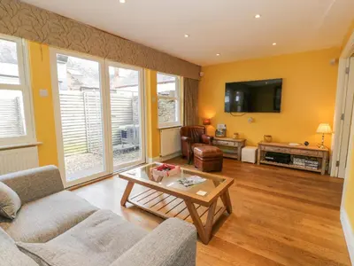 a living room with a couch and a coffee table at The Suite in Thornhill