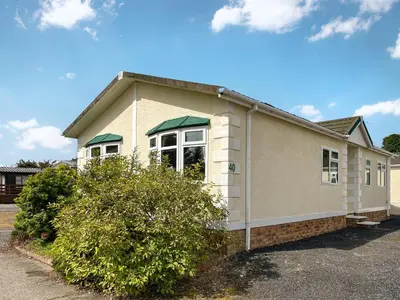 a small house in a parking lot at Tredegar in Newton Stewart