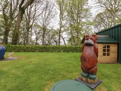 a statue of a dog in a yard at The Nest in Carlisle