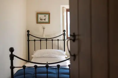 a bedroom with a bed and a picture of a horse at Bank Barn, Wreay in Penrith
