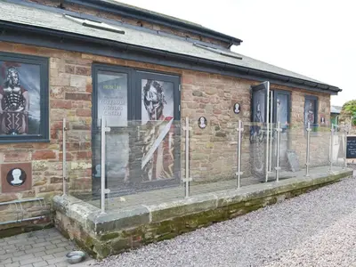 a brick building with posters on the side of it at Haaf Netters Rest - Uk43557 in Bowness-on-Solway