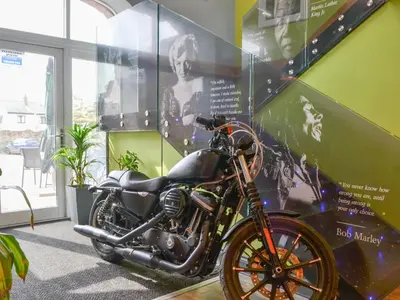 a motorcycle parked in a room with a wall at Hannah's Shepherds Hut - Uk43564 in Bowness-on-Solway