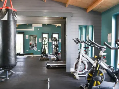 a gym with two exercise bikes and a punching bag at Hannah's Shepherds Hut - Uk43564 in Bowness-on-Solway
