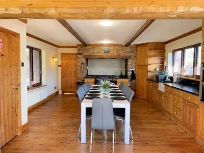 a dining room with a white table and chairs at Beautiful 5BR House near Gretna Green with Garden - Pass the Keys in Kirkpatrick Durham