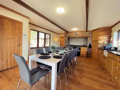 a dining room with a white table and chairs at Beautiful 5BR House near Gretna Green with Garden - Pass the Keys in Kirkpatrick Durham