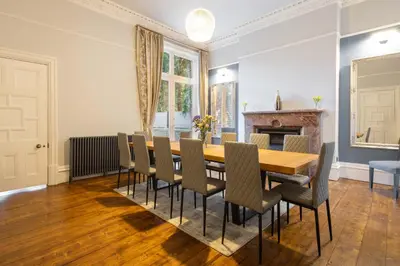 a dining room with a wooden table and chairs at Host & Stay - Chatsworth Townhouse I in Carlisle