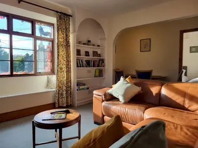 a living room with a couch and a table at Wheelwrights House in Ambleside