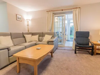 a living room with a couch and a coffee table at Stanwix Cottage in Carlisle
