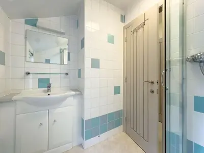 a bathroom with a sink and a shower at RIDGEMOUNT APT - Great base for walking and cycling in Keswick, Lake District National Park in Keswick