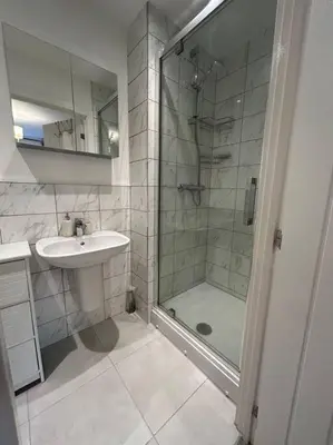 a bathroom with a sink and a shower at Lake District Haven - Modern Comfort in Cockermouth in Cockermouth