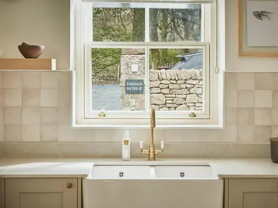 a sink in a kitchen with a window at Eskdale Retreat in Holmrook