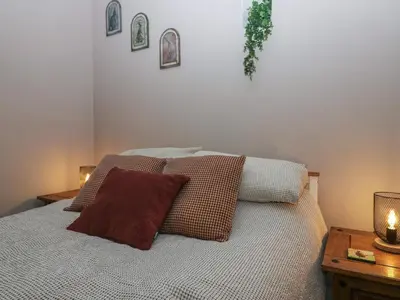 a bedroom with a bed with two pillows on it at Benstead Cottage in Seascale