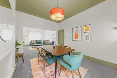 a dining room with a table and chairs at Boutique Home in Lake District, West Cumbria in Workington