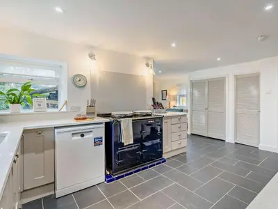 a large kitchen with a stove and a counter top at 4 Bed in Keswick oc-95739 in Bassenthwaite